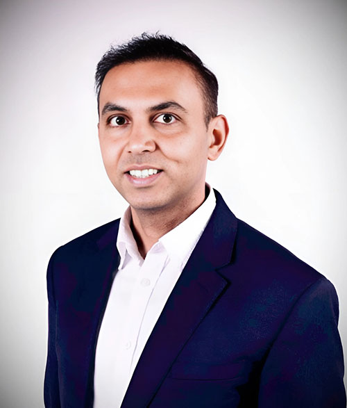 Dr Sourabh Singh, specialist private adult psychiatrist based in London, UK. A man of Indian descent, smiling at the camera